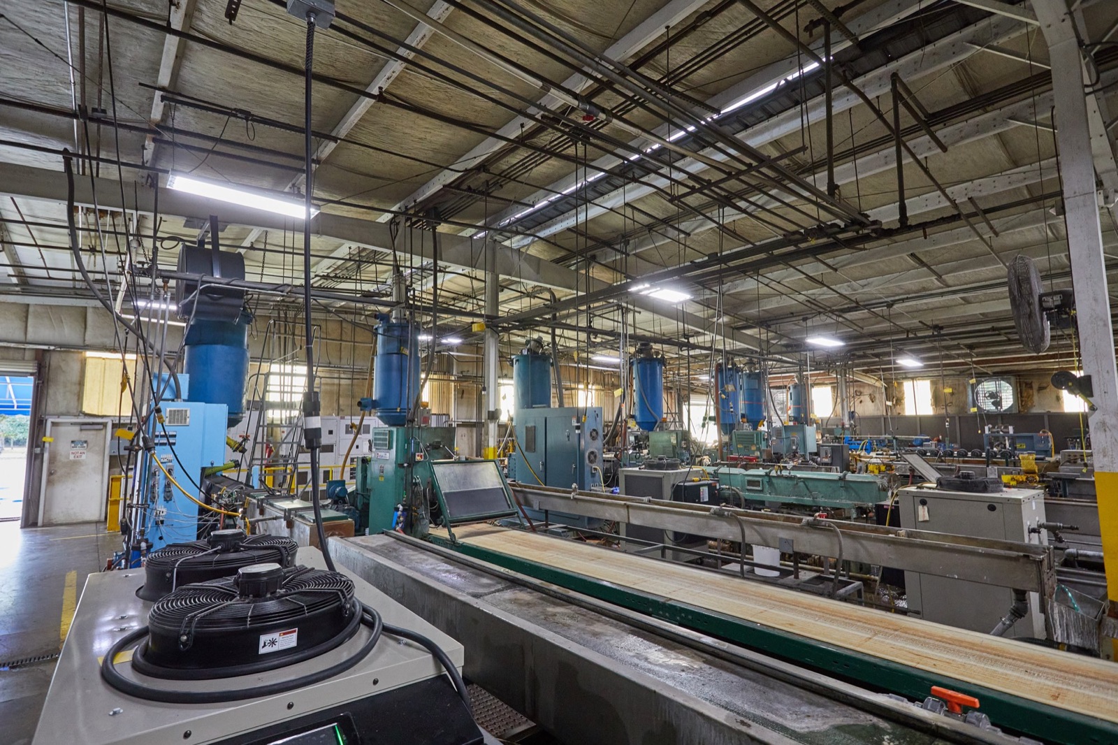 Row of extrusion lines on the Custom Profiles plant floor